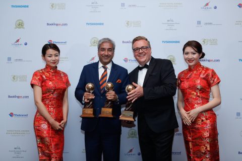 Sandeep Dayal, Head of Sales and Business Development, Cox & Kings (left) displaying the trophies along with Chris Frost, Vice President, World Travel Awards (right) at the World Travel Award ceremony in China.